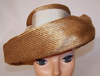 This is a vintage 1950s Leslie James ladies sailor hat. It is made of
