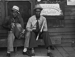 washboard in front of a store near new iberia louisiana 1938 zydeco