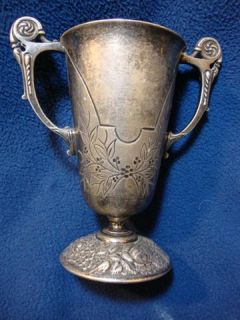 Meriden Silver Plate Co . Pewter handled cup. Pattern 1273. 6 tall